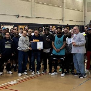 MNBL players and coaches with Mayor Gary Christenson (center) and Commissioner Ken Mazonson (left of Mayor). (Courtesy photo)