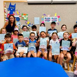 NO SUMMER SLIDE HERE: Local educator Toni-ann Merlina with first- and second-graders in the Summer Reading Program at the Saugus Public Library. (Courtesy Photo of Amy Melton)
