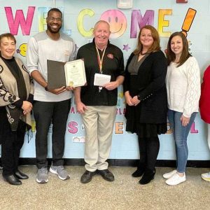 From left: School Committee Chairperson Mike Mangan, Interim Superintendent William Hart, Ward 1 School Committee Member Millie Cardello, Director of Veterans Affairs Antoine Coleman, custodian Nick Nuzzo, Webster School administrators Devon Abruzzese and Samantha Grant, Ward 3 School Committee Member Jeanne Cristiano and Webster School Principal Christopher Barrett.
