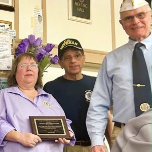 OUTSTANDING COMMUNITY SERVICE: Left to right: Women’s Auxiliary President Louise Davis of American Legion Post #210, Saugus American Legion Post Commander John Macauda and American Legion District 8 Commander Peter Whitman during last week’s presentation of the George “Al” White Memorial Award to Auxiliary Unit #210. The award cited the auxiliary’s work in organizing and hosting “a joyful bingo event” at the Veterans Home at Chelsea. The American Legion Department of Massachusetts presents the award monthly to honor outstanding contributions by American Legion posts, units, squadrons or auxiliaries judged to have performed an outstanding Community Service project for the betterment of the community. (Courtesy photo of Joanie Allbee)