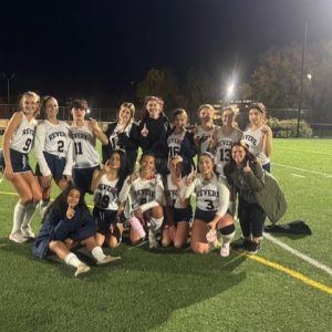 RHS Head Coach Victoria Correia is celebrating the GBL Field Hockey Championship with her team.
