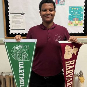 PCSS senior Moses Gebregziabher, of Everett, displays pennants from Dartmouth, Harvard and MIT. He was accepted into all three prestigious schools. (Photos courtesy of PCSS)