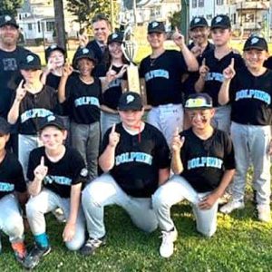 The Dolphins are the 2024 Malden Youth Baseball Cal Ripken Majors Division City Series Champions for the second straight year. Shown above are team members and in the rear, from left, coach Jason Nickerson, Malden Mayor Gary Christenson and Dolphin longtime manager Kenny Mazonson. Team members include Zachari Breton, Dmitri Carnell, Jacob Christie, Nicholas Cook Tran, Jeffrey Cooper, Christopher Ferreira, Jax Marinko, Sean McAuliffe, Izaiah Paredes, Brendan Skerry and Lorenzo Solis. (Advocate Photo)
