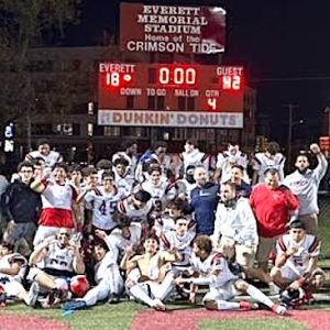 SCOREBOARD: Revere Patriots line up right in front of the winning scoreboard. (Steve Freker Photo)