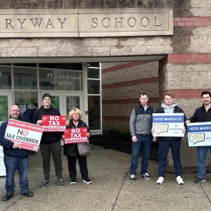 Supporters of both sides of the Proposition 2 1/2 Override ballot questions appeared in front of the Ferryway School entrance in advance of Monday’s informational forum. (Advocate Photos)
