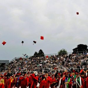 A CASCADE OF CAPS: At the end of the commencement exercises, the young graduates celebrated by flinging their caps skyward.