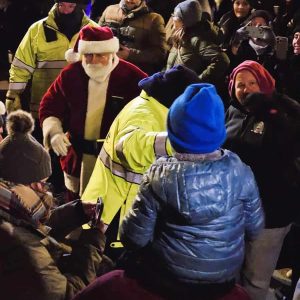 Santa makes his way through the crowd.