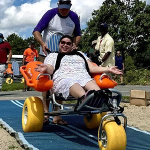 Triangle CEO Coleman Nee and Marilyn demonstrate DCR’s Floating Wheelchairs and Mobility Mats.