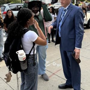 Superintendent Dr. Timothy Sippel talks with students outside Malden High School on the first day of school. (Advocate Photos)