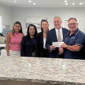 Rep. Joe McGonagle with Rocco Longo and the staff of Sabatino/Mastrocola Insurance.