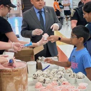 ‘CHOCOLATE OR RAINBOW’: Mayor Gary Christenson is in charge of the city of Malden as well as being in charge of administering sprinkles on the kids’ ice cream bowls.