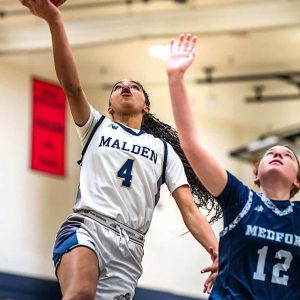 Senior Amanda Ebenezer (4) cuts through the defense with a layup. (Advocate Photos/Henry Huang)