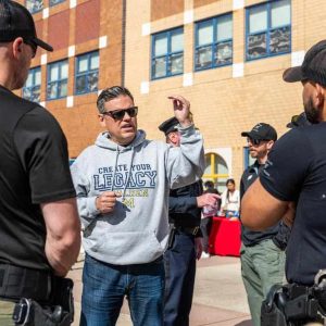 MAYOR AND SPECIAL OPERATIONS: Malden Mayor Gary Christenson talks with Malden Police Special Operations Unit members.