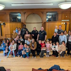 Malden fire fighters are shown with the children during the department's event at the MPL.  (Courtesy photo)