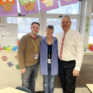 Superintendent William Hart (at right) is pictured with Parlin School guidance counselor David Weinberg and kindergarten teacher Karen Schastny, who invited the Superintendent to read to her students on Friday, March 8, 2024.