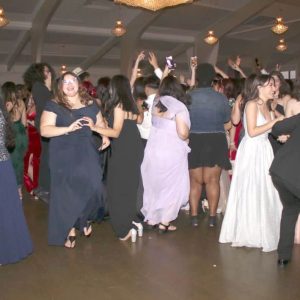Seniors enjoying themselves at their prom.