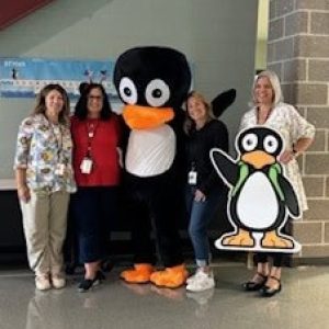 Pictured from left to right: A.C. Whelan School Assistant Principal Nicole Cascetta, Math Coach Candi Conley, JiJi, Math Interventionist Janelle Sutherland and Principal Rachel Shanley.