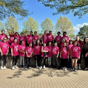 State Senator Sal DiDomenico and his staff standing with students participating in Girls on the Run.