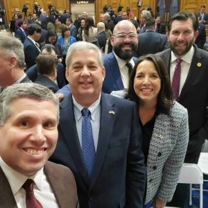 Senator Sal DiDomenico (front) with Lieutenant Governor Kim Driscoll and Senate colleagues in the State House Chamber.