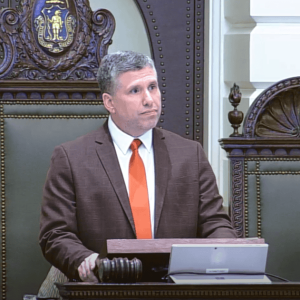 Senator Sal DiDomenico speaking at the Massachusetts Senate rostrum during debate.