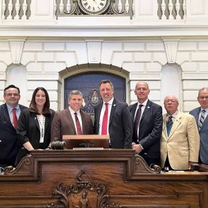 Senator Sal DiDomenico in the Senate Chamber (third from left) with the Consul General of Italy in Boston, Arnaldo Minuti (fourth from right), Senator Nick Collins (far left), Senator Robyn Kennedy (second from left) and the Consul General’s team.