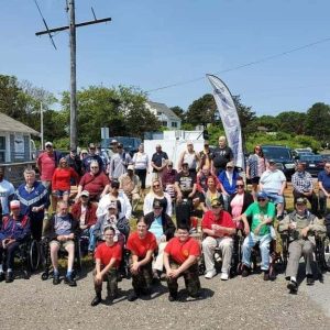 READY TO SET SAIL: A group photo of the veterans from the Chelsea Soldier’s Home with MMSF President & CEO Don Cox, Rep. Steve Xiarhos, Rep. Joe McGonagle, former Rep. Tim Whelan. (Courtesy of Rep. McGonagle)