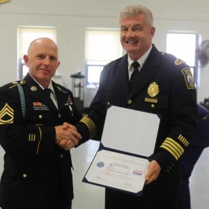 Sgt. First Class Sean Matthews presents the Employer Support of the Guard and Reserve (ESGR) Patriot Award to Police Chief David J. Callahan.