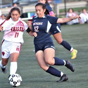 Revere junior midfielder Sandra Torres is shown battling for ball possession against a Chelsea opponent in last year’s action. (Advocate file photo)