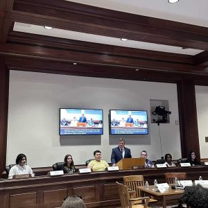 Senator DiDomenico speaking alongside students and advocates in the State House.