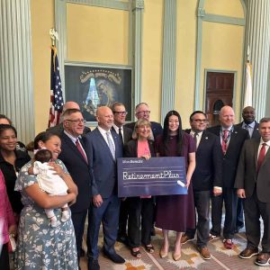 Senator Sal DiDomenico with education union leaders and Senate leaders in the Senate Reading Room before the bill’s passage.