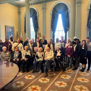 Senator Sal DiDomenico with colleagues and the entire group who came to the State House to give legislators their artwork.