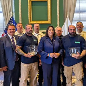 Front row, pictured from left to right: Representative Joseph McGonagle, Mayor Carlo DeMaria, Jason Papa, Lieutenant Governor Kim Driscoll, Jesse Winocour and Senator Sal DiDomenico.