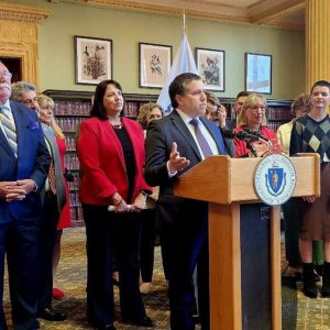 State Senator Sal DiDomenico speaking at the press conference alongside Governor Maura Healey, Lieutenant Governor Kim Driscoll, State House colleagues, and advocates.