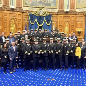 Senator Sal DiDomenico (far left) stands alongside fire chiefs and State House colleagues in the House Chamber.