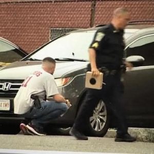 Searching for evidence in the Main & Ferry Street parking were uniformed and plainclothes Malden Police Officers and detectives following Sunday’s shooting. (Courtesy Photo)