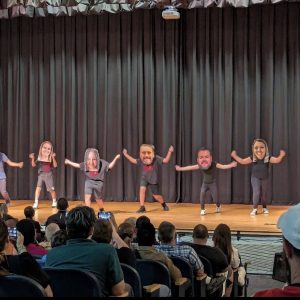 Third place went to the unforgettable teacher bobblehead skit!