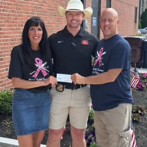 Stephen Ramunno receives a check for $1,000 from Everett Charity Softball. From left: Kimberly Nicolo, Stephen Ramunno and Peter Sikora. (Photo courtesy of Peter Sikora)