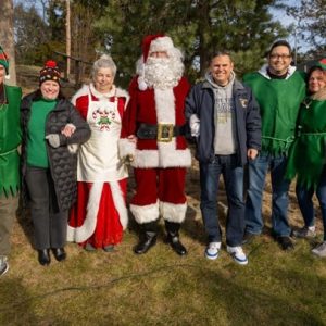 From left: Santa, Mrs. Claus and elves: Pete Caso, Melrose Mayor Jennifer Grigoraitis, Barbara Murphy, Santa Claus, Mayor Gary Christenson, Adam Weldai and Ward 1 Councillor Peg Crowe.