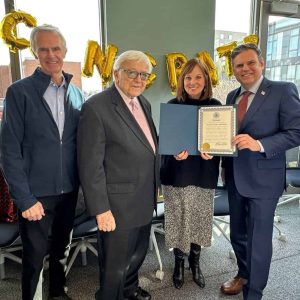 FOR UNWAVERING DEDICATION TO MALDEN: Pictured from left to right: Former Malden Mayors Richard Howard and Ed Lucey, Deborah Burke and Mayor Gary Christenson.  (Courtesy City of Malden)