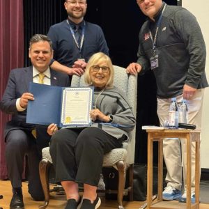 Pictured from left to right: Mayor Gary Christenson, MHS Social Studies Teacher Leader Kurtis Scheer, Janet Singer Applefield and MHS Principal Chris Mastrangelo.
