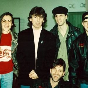 LIVIN’ THE DREAM: Extreme bandmates Nuno Bettencourt, Gary Cherone, Pat Badger, and Paul Geary (front) with former Beatle George Harrison.