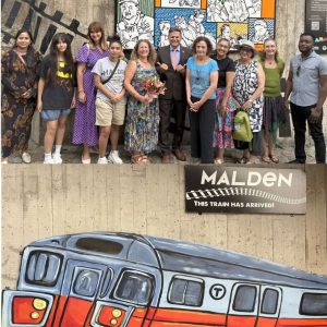 Mayor Gary Christenson (center) and Malden artists, including “Trains” mural artist Naomi Kahn (left of Mayor) and Creative Malden President Sandy Felder (right of mayor).