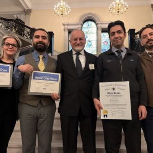 Pioneer Charter School of Science staff posed with Certificates of Recognition and an Official Citation from the State Senate at the State House ceremony. (Photo Courtesy of Pioneer Charter School of Science)