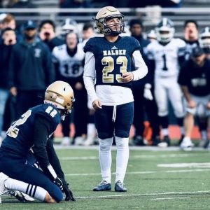 Above, Malden High senior placekicker Ronald Juarez and holder Gavin West prepare for the game winning field goal in this past season's 137th Malden-Medford Thanksgiving Day football game, now the longest continuous high school football rivalry in the nation. This past fall was the first full season of Greater Boston League football competition. (Courtesy Photo/ Malden High School Athletics)