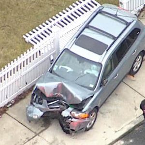 Police say the driver of this SUV struck and killed a dog and crashed into a house on Webster Street. (Courtesy/CBS News Boston)