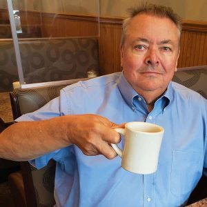 Precinct 8 Town Meeting Member Thomas E. Traverse relaxed with a coffee after a recent interview. He is one of several Precinct 8 Town Meeting members who are expected to appear at the Saugus Public Library next Monday (Aug. 14) at 6:30 p.m. for the latest “Saugus Over Coffee” forum. (Saugus Advocate photo by Mark E. Vogler)