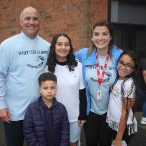 Seventh-grader Thallya Martins, seventh-grader Maria Da Silva, Matheus Da Silva, English Language Learners Coordinator Alyssa Allen and Principal Michael McLucas.