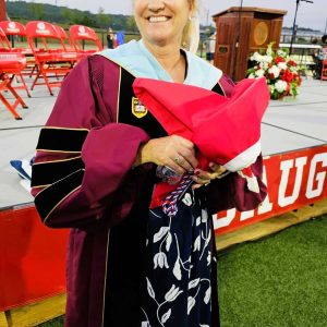 RECALLING THE WIZARD: Saugus Middle-High School Principal Carla Scuzzarella at last Friday’s graduation.