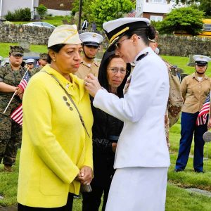 RECEIVING HER MEDAL: U.S. Naval Commander Shelby M. Nikitin (right) pinned the Medal of Fidelity on Gold Star Wife Maria Sousa. (Saugus Advocate photo by Mark E. Vogler)
