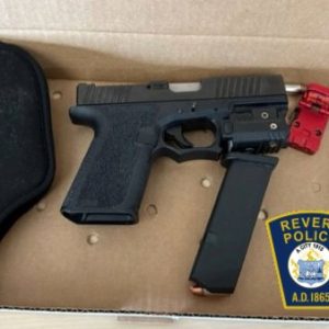 A 9mm handgun and a loaded clip are shown above. (Courtesy of Revere Police Dept.)